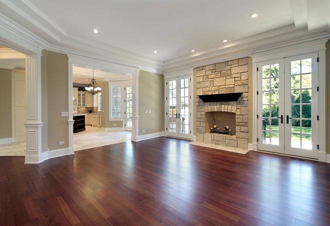 cozy bedroom with warm, rich wood flooring